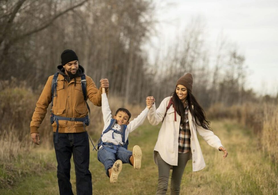Family walking together for Canadian spousal sponsorship and family sponsorship planning